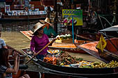 Thailand, Locals sell fruits, food and products at Damnoen Saduak floating market near Bangkok 